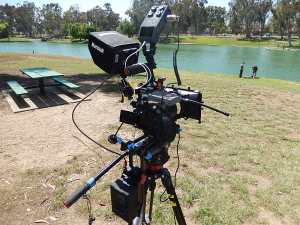 Full cinema rig configuration with HDMI monitor, whip/follow focus, Zoom H6, AudioTechnica wireless lav system and rear brick battery with D -taps to camera, light, DAR or monitor