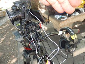 side view showing connections for digital audio recorder positioned below camera